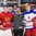 BUFFALO, NEW YORK - DECEMBER 29: Belarus' Andrei Grischenko #20 and Russia's Klim Kostin #24 are recognized as players of the game during the preliminary round of the 2018 IIHF World Junior Championship. (Photo by Andrea Cardin/HHOF-IIHF Images)


